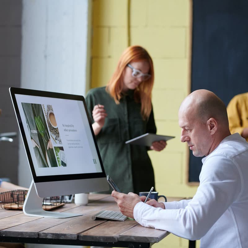 Businessman and woman in office